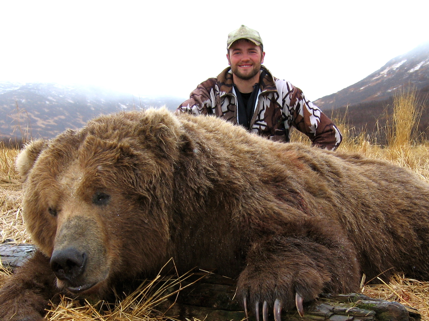Billy Molls in the wilderness with a bear